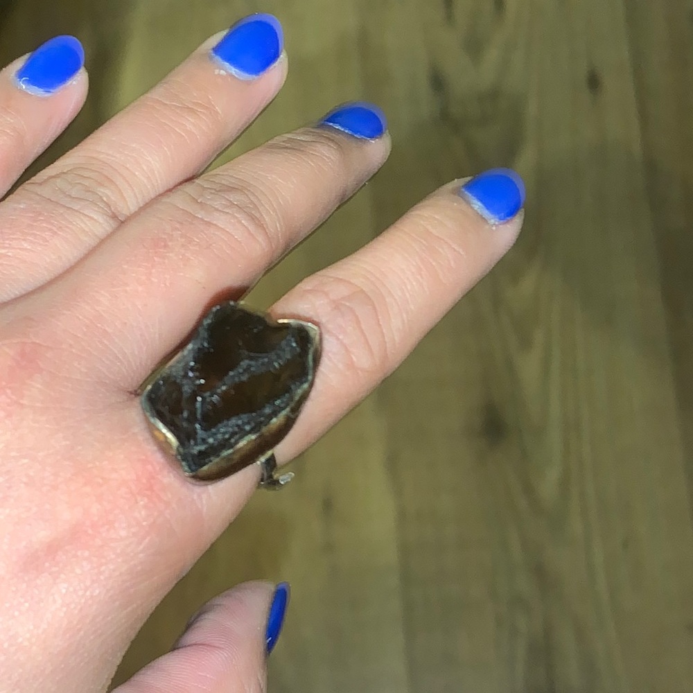 Black crystal ring with adjustable band. Best for size 6-7